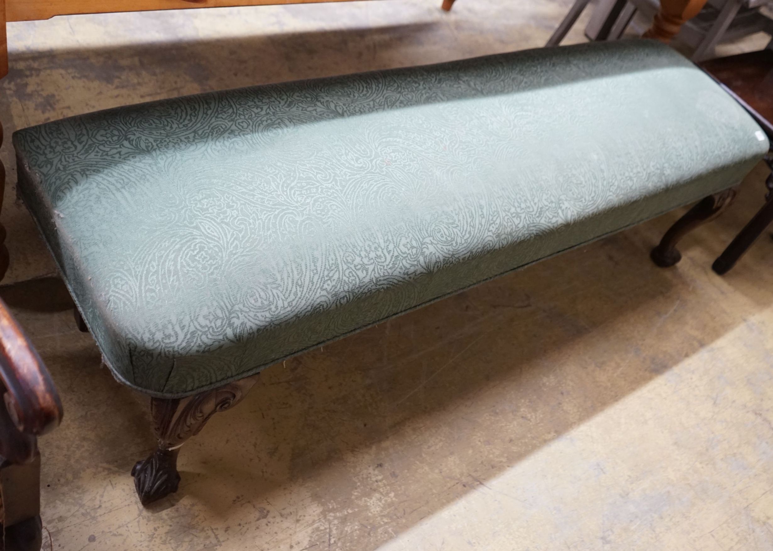 A George II style upholstered window seat on carved cabriole legs, length 168cm, depth 46cm, height 48cm